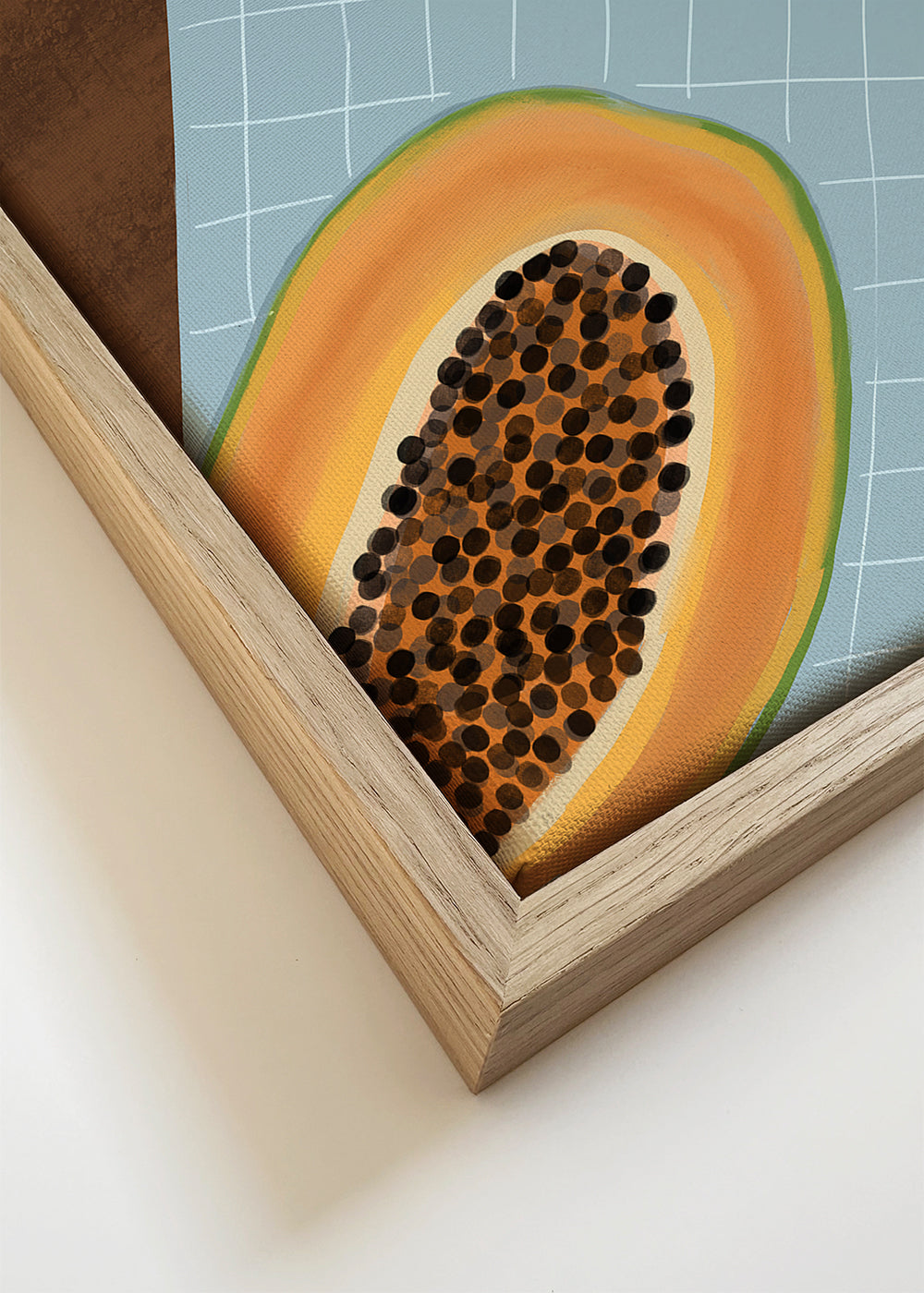 Køkkenkunst: halve papaya på ternet stof