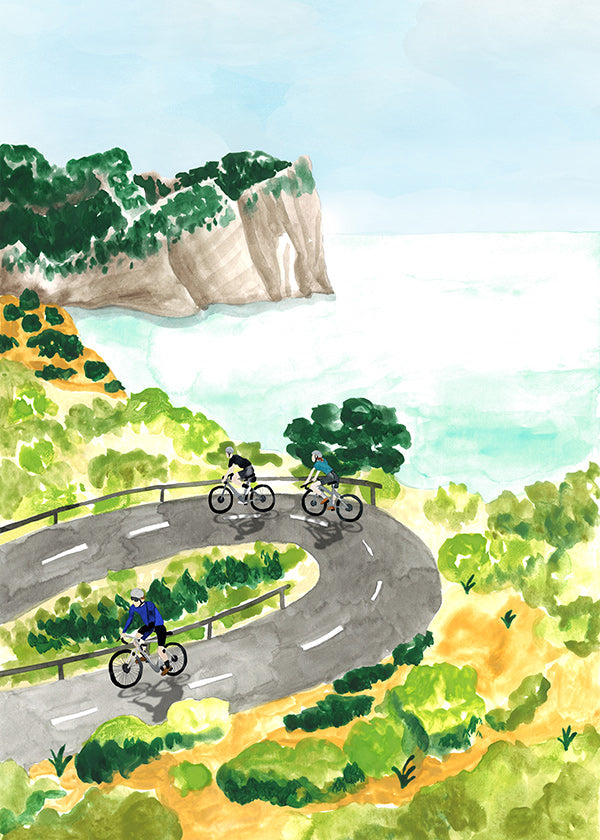 Sportkunst med cykling ved kysten