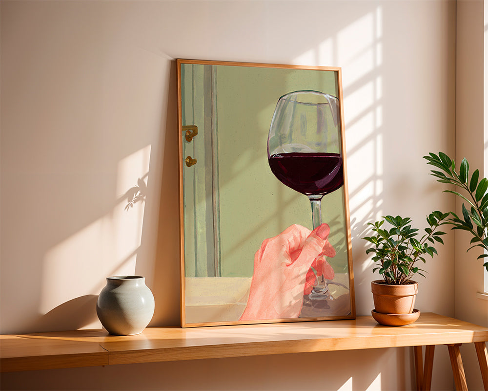 Køkkenkunst med vinglas og hånd