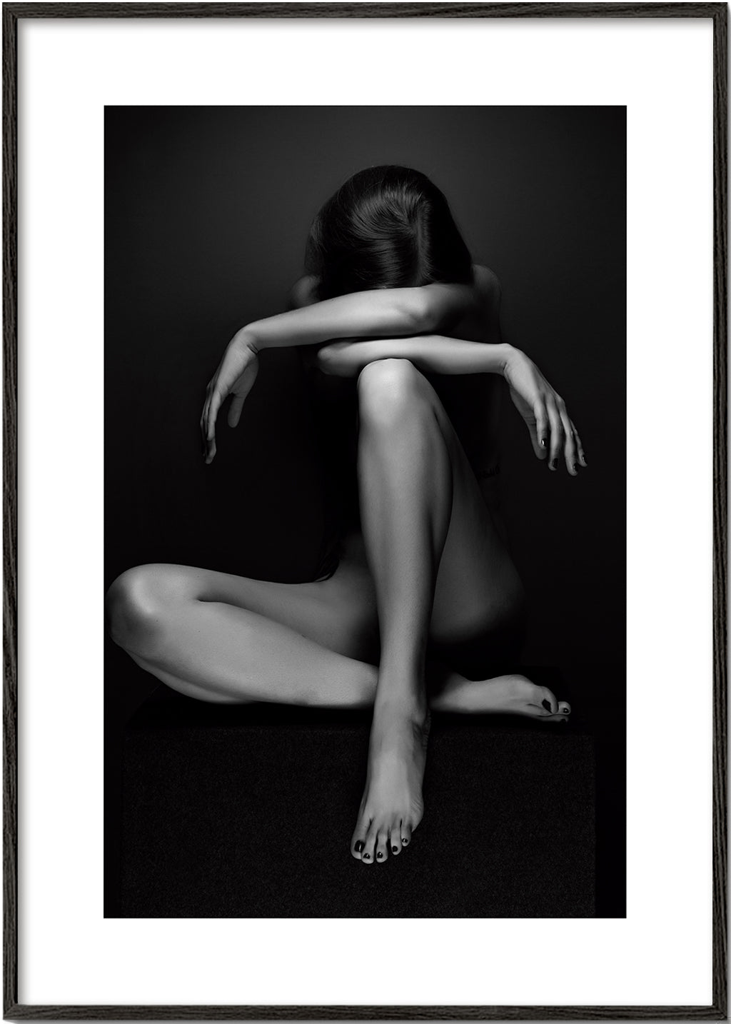 Fotografi af siddende figur i studie
