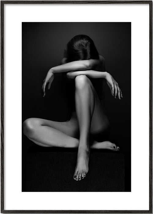 Fotografi af siddende figur i studie