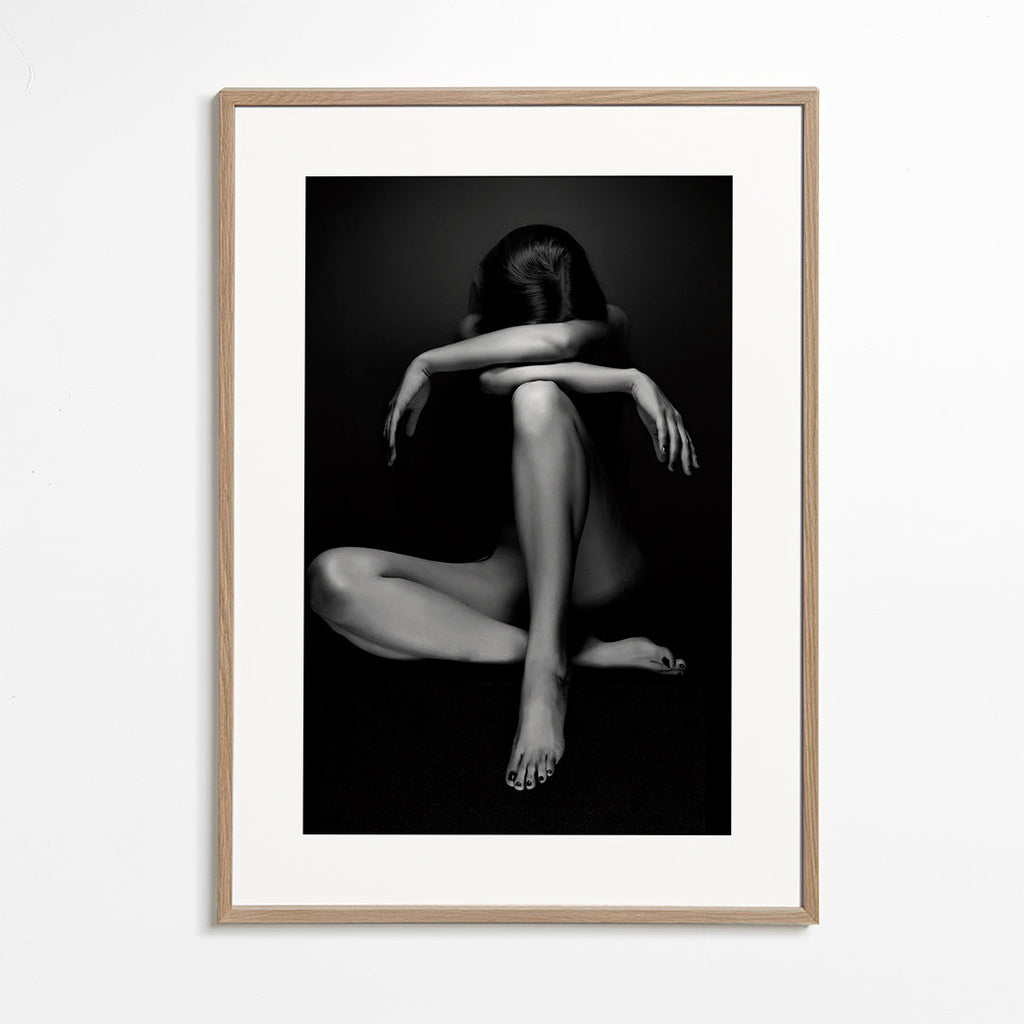 Fotografi af siddende figur i studie