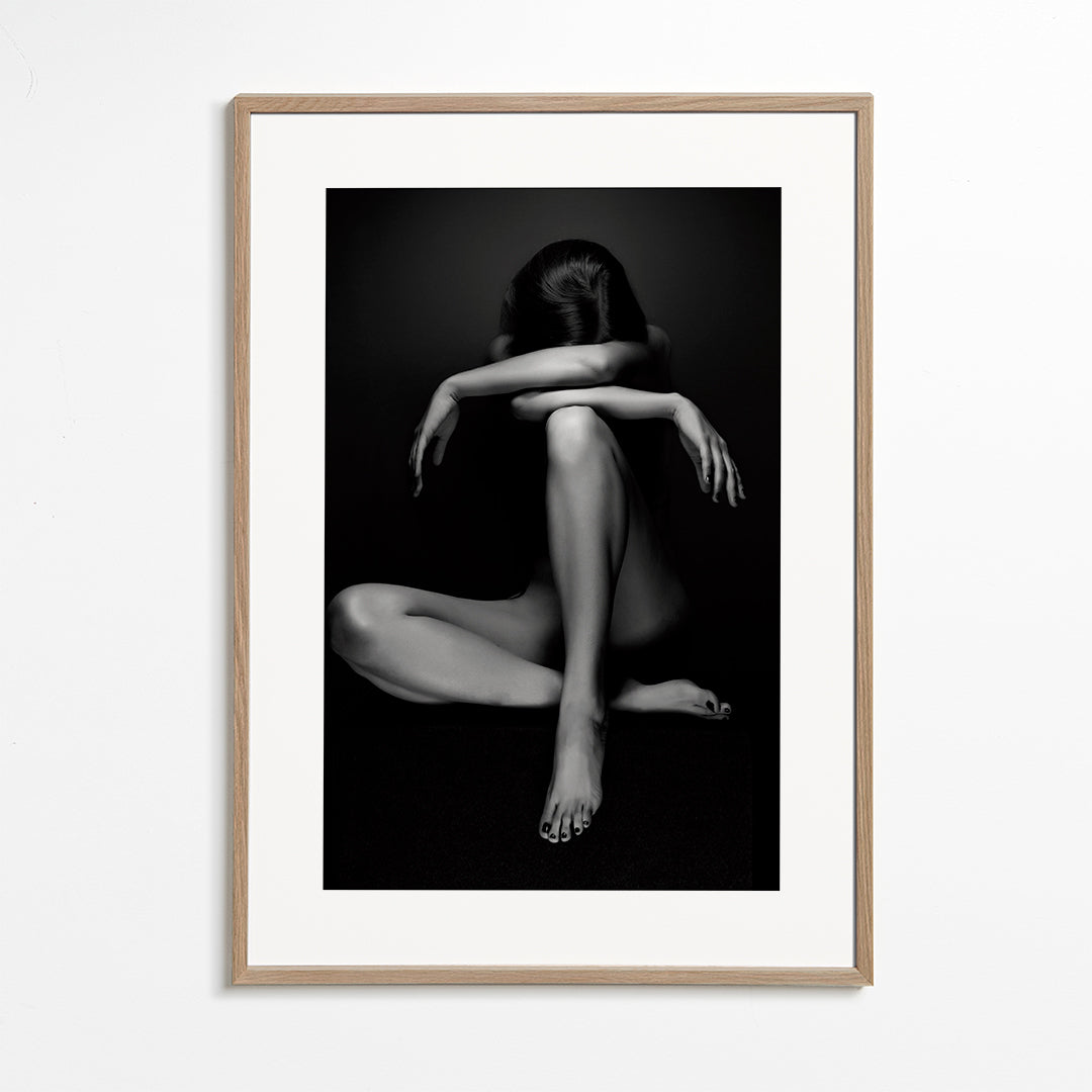Fotografi af siddende figur i studie
