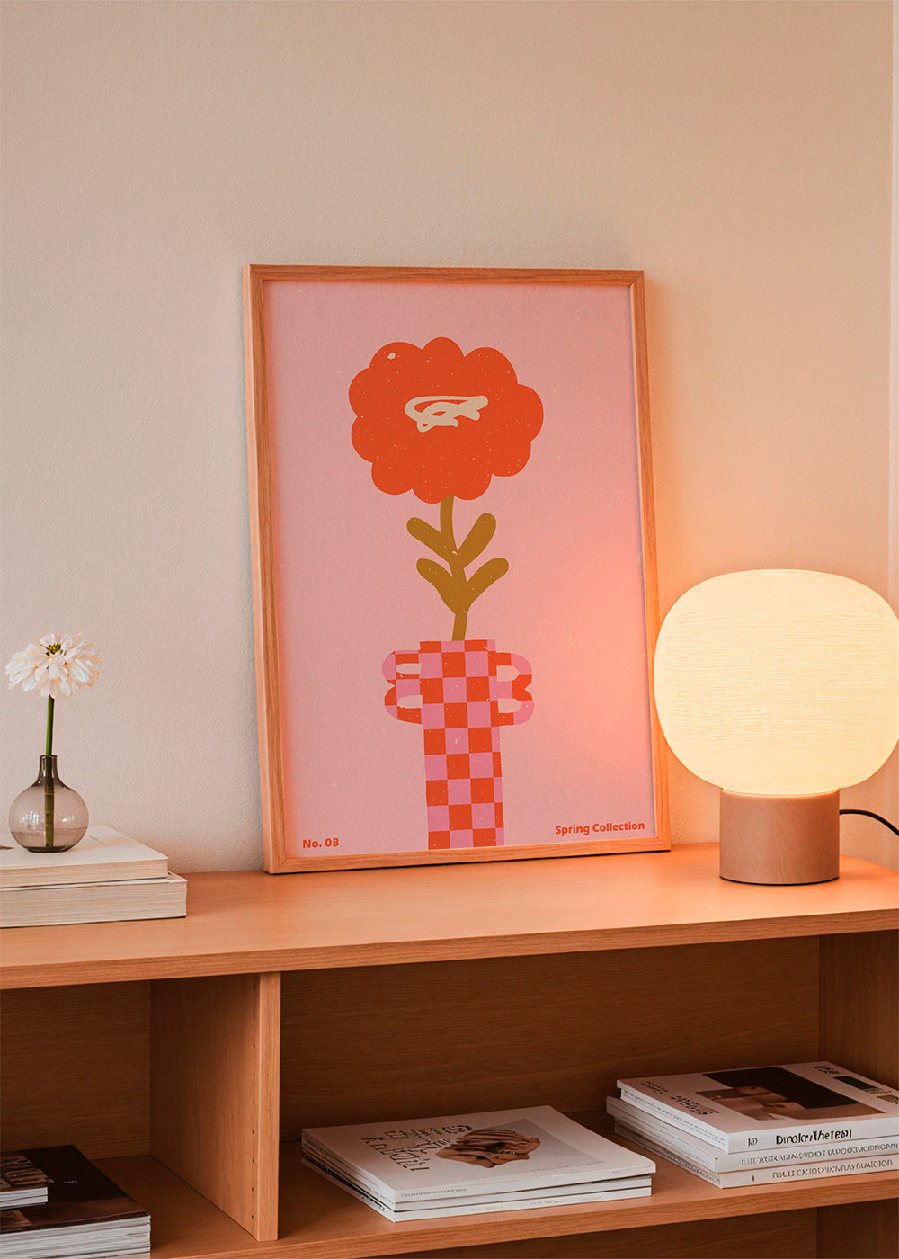 Botanisk plakat: orange blomst på lyserød baggrund