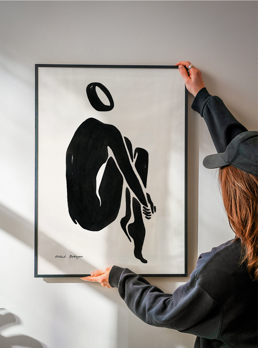 Sort-hvid kunst med siddende silhuet