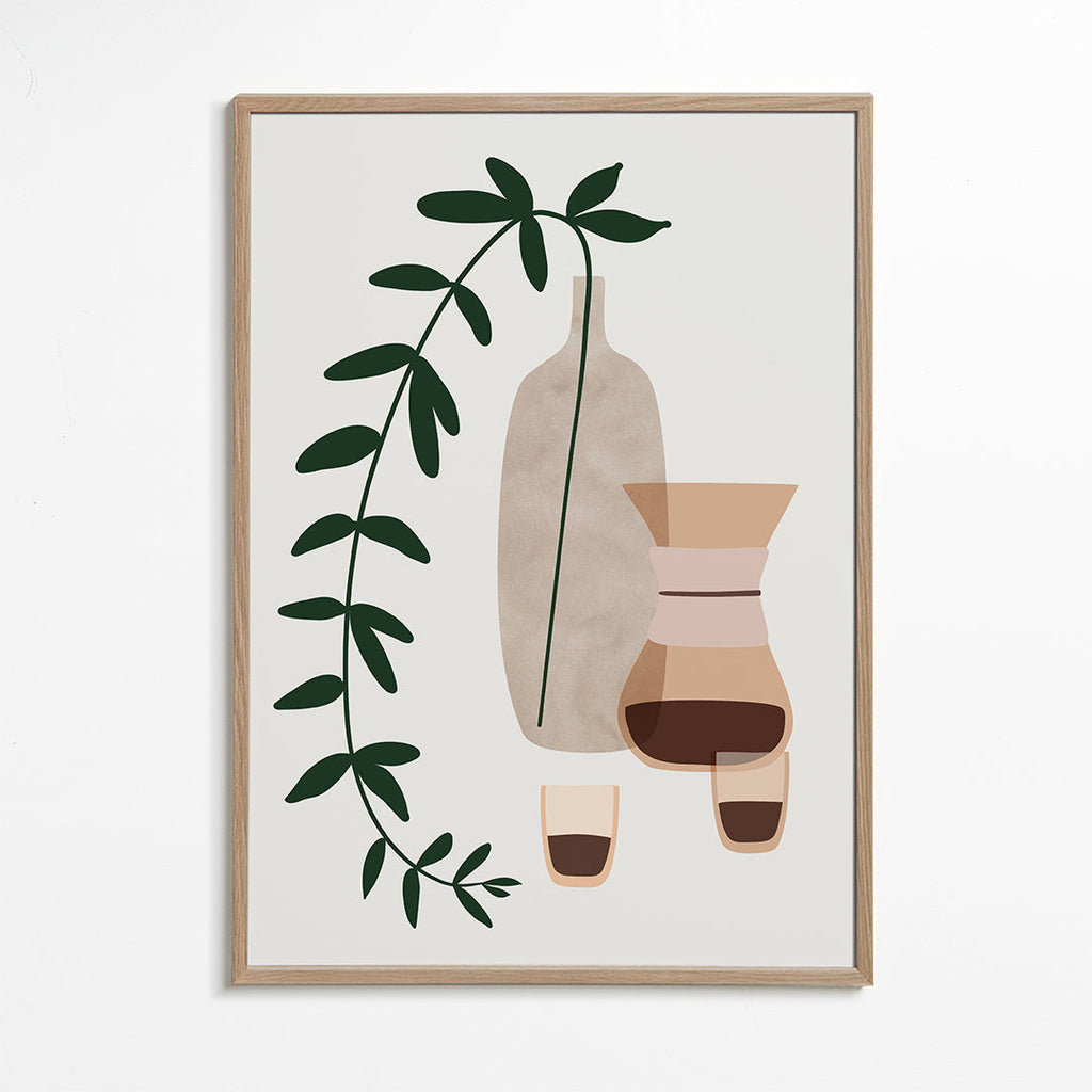 Køkkenkunst med kaffekande og botanisk gren