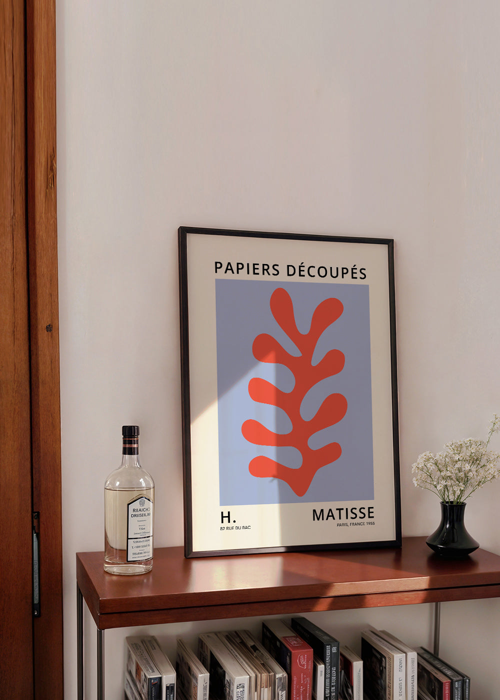 Botanisk plakat Matisse-stil: rødt blad på blåt felt