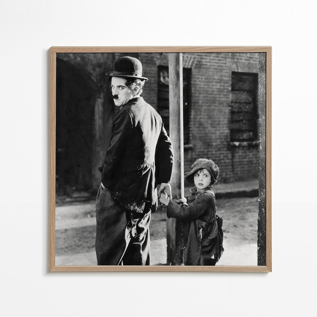 Vintage-portræt: mand med bowlerhat og barn