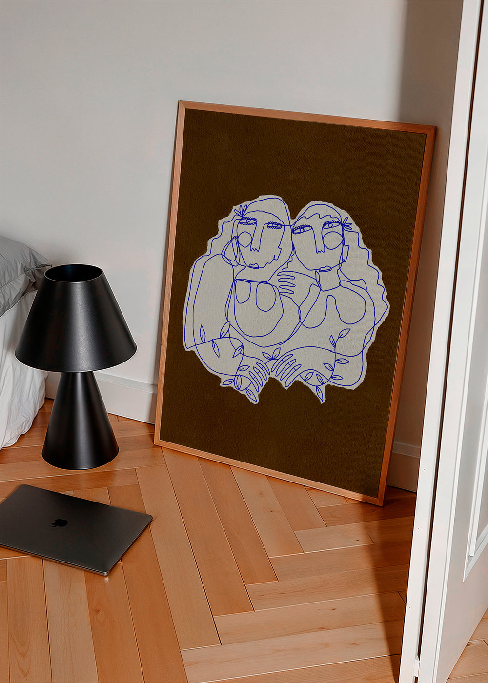 Linjeillustration af to omfavnende figurer