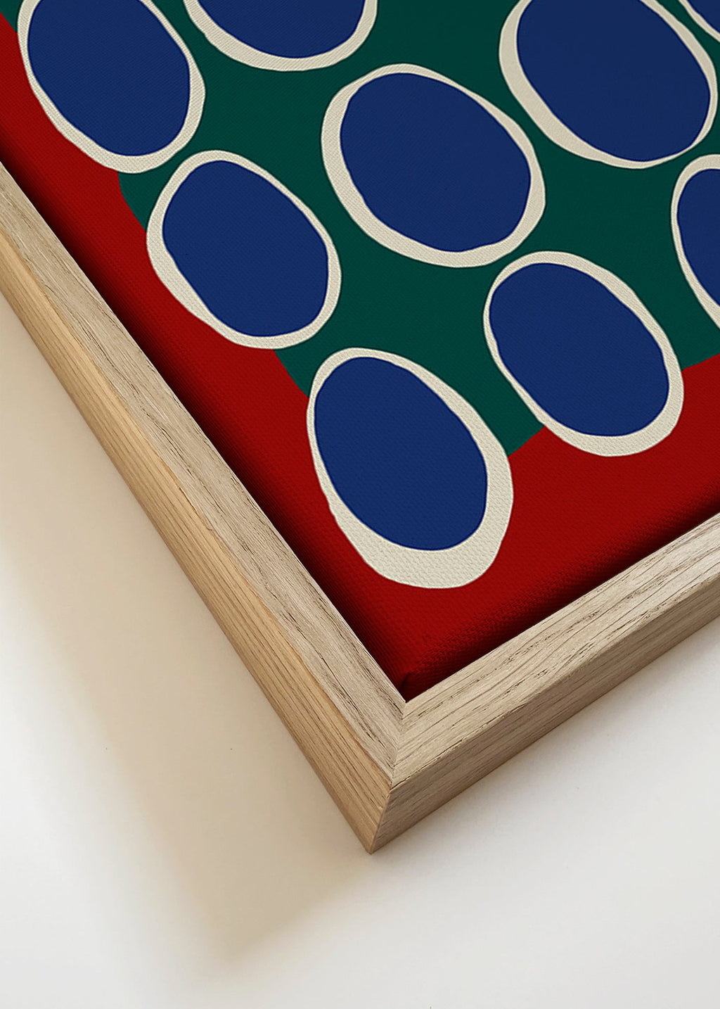 Geometrisk billede med blå ovaler og grønt felt – Canvas detail