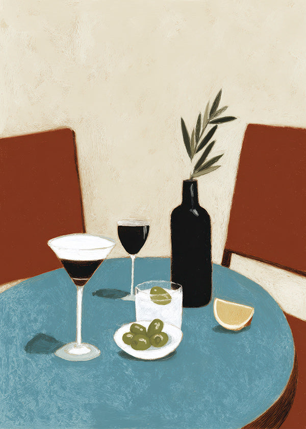 Køkkenkunst med aperitif på blå bord