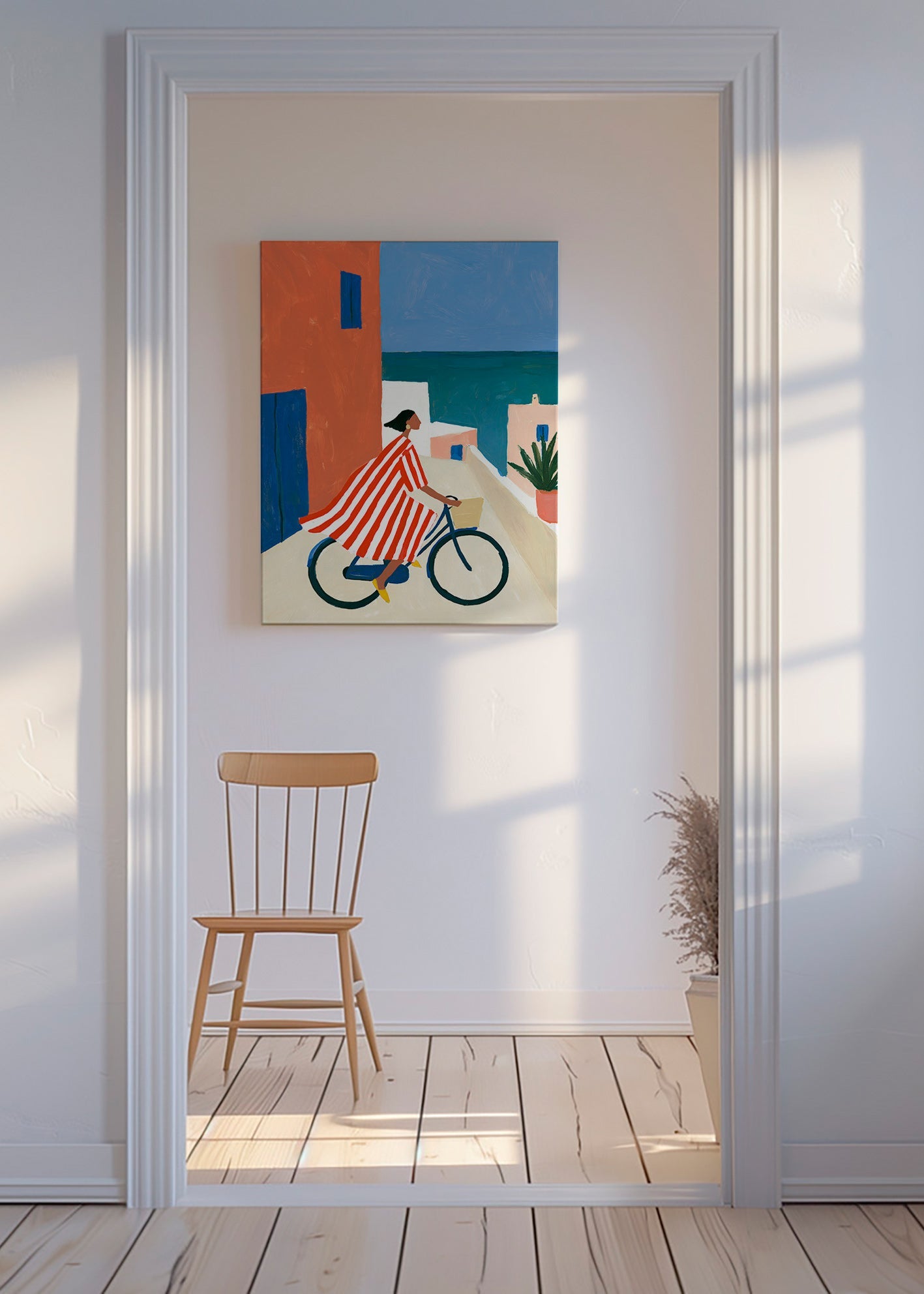 Landskabskunst med cyklist ved havet