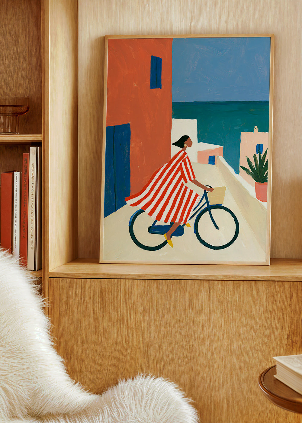 Landskabskunst med cyklist ved havet