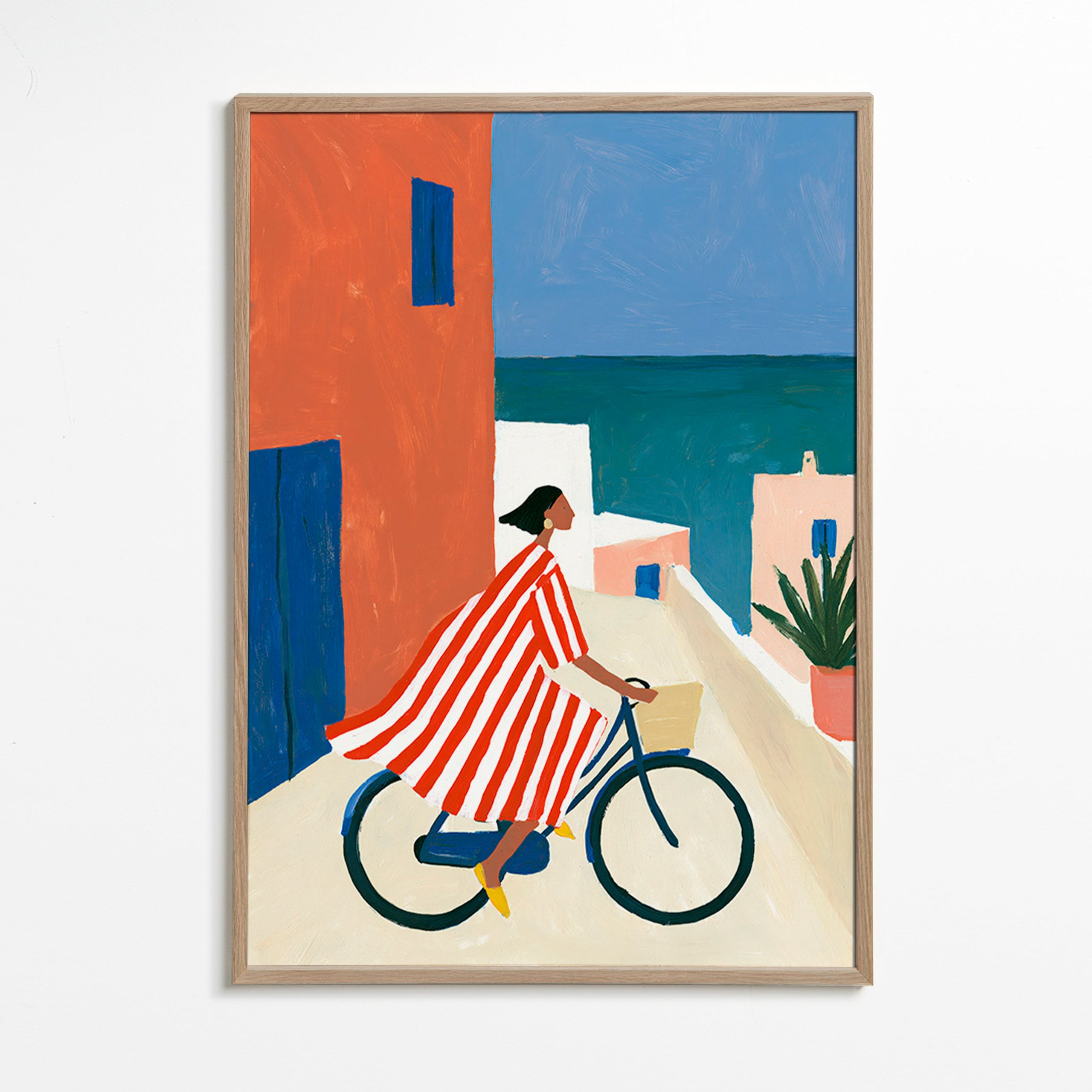 Landskabskunst med cyklist ved havet